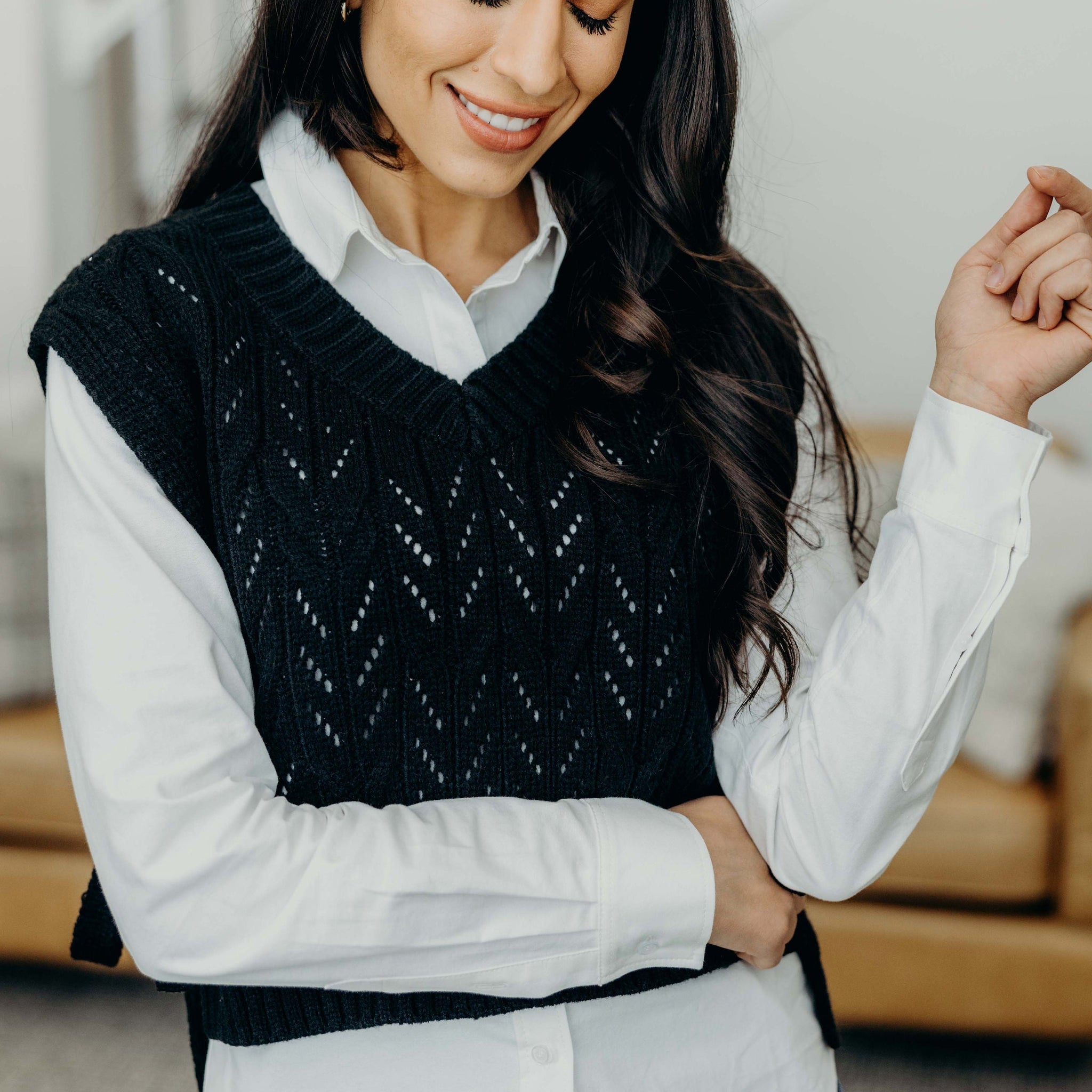 CABLE KNIT SWEATER VEST IN BLACK